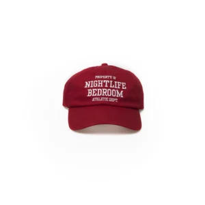 A red baseball cap with white text on the front.